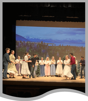 Students performing Seven Brides for Seven Brothers play